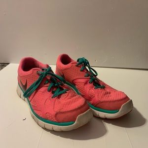 Pink and teal tennis shoes